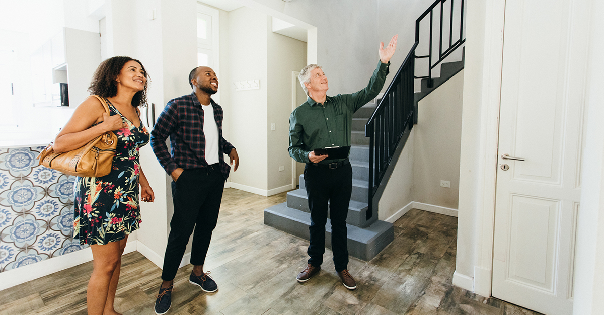 An agent shows a couple a home